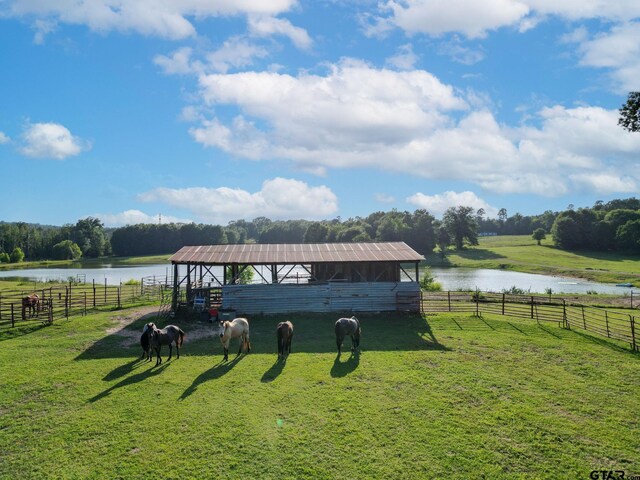 2711 N Fm 250, Hughes Springs, TX 75656 - view of community with an exterior structure, a rural view, an outbuilding, and a water view