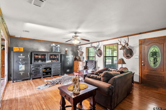 2711 N Fm 250, Hughes Springs, TX 75656 - living room with wood-type flooring, ceiling fan, and crown molding