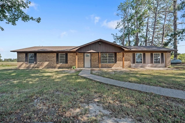 ranch-style home with a front lawn