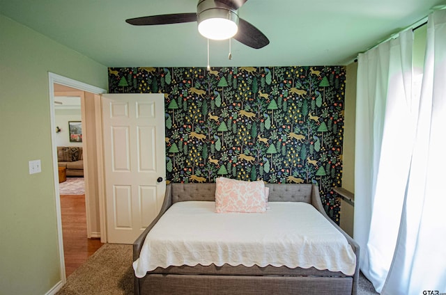 bedroom with hardwood / wood-style flooring and ceiling fan