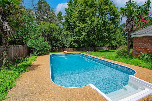 view of pool featuring a diving board