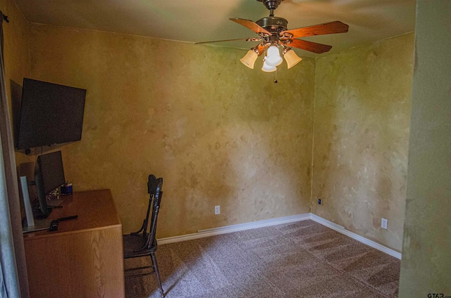 unfurnished office featuring carpet and ceiling fan