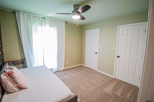 carpeted bedroom featuring ceiling fan