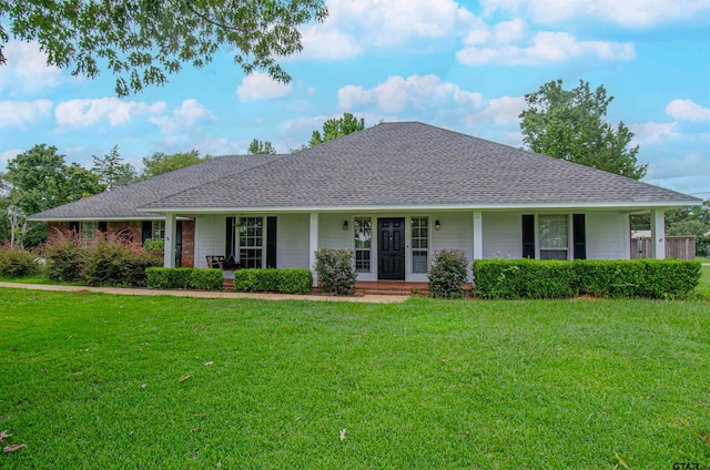 single story home featuring a porch and a front yard