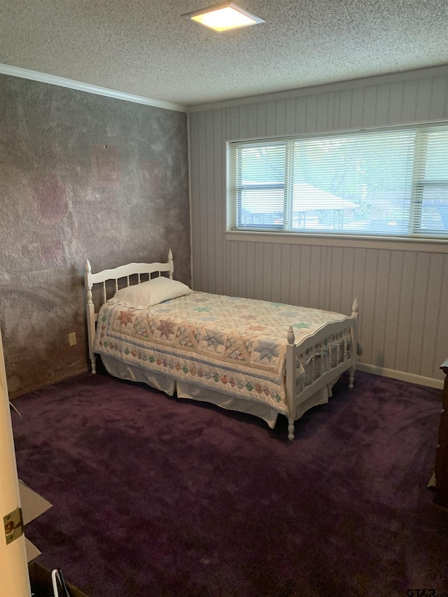 bedroom with a textured ceiling and carpet