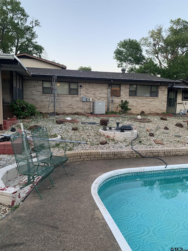 pool featuring a patio and central AC