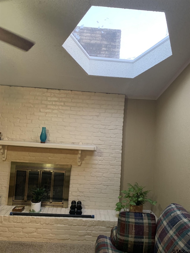 room details with a skylight, ornamental molding, and a fireplace