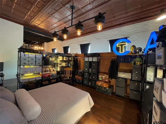 bedroom with hardwood / wood-style floors