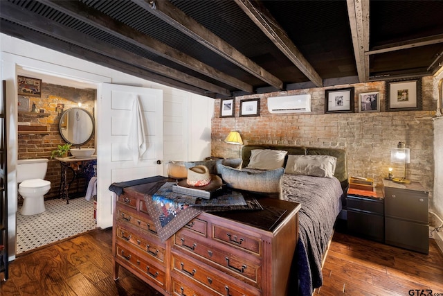 bedroom featuring a wall mounted air conditioner, dark hardwood / wood-style floors, beam ceiling, and brick wall