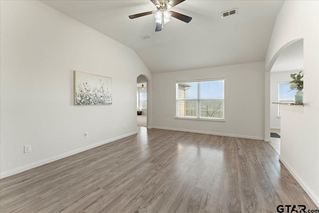 unfurnished living room with vaulted ceiling, ceiling fan, and light hardwood / wood-style floors