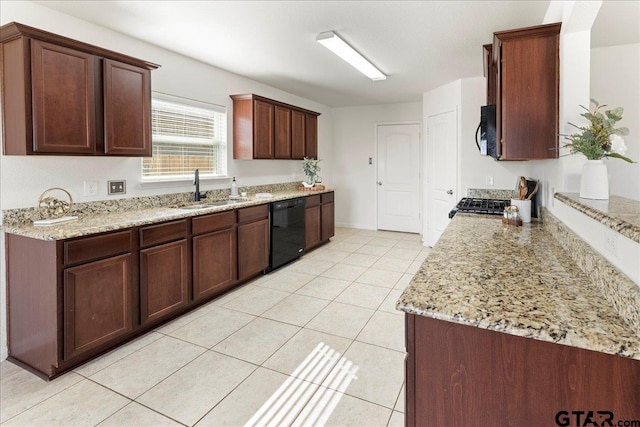 kitchen featuring light stone counters, sink, black dishwasher, and light tile patterned flooring