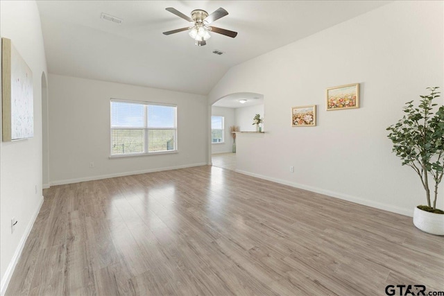 unfurnished living room featuring lofted ceiling, light hardwood / wood-style floors, and ceiling fan