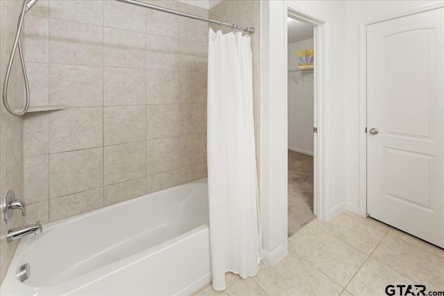 bathroom with tile patterned flooring and shower / bath combo with shower curtain