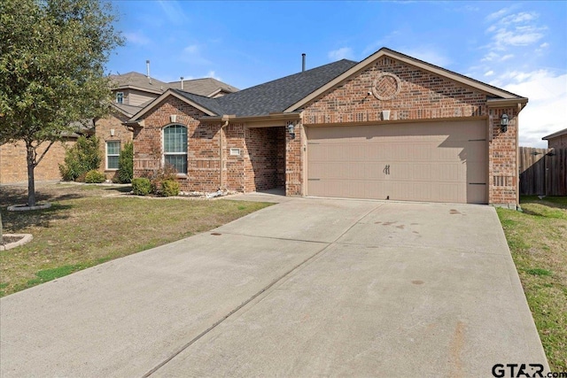 ranch-style home featuring a garage and a front yard