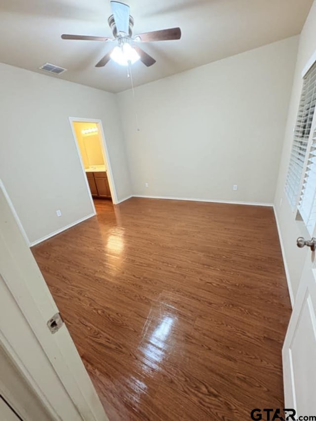 19481 Big Valley Dr, Flint, TX 75762 - unfurnished bedroom with wood finished floors and a ceiling fan