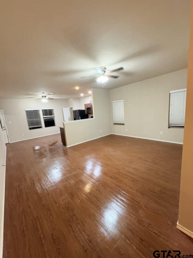 19481 Big Valley Dr, Flint, TX 75762 - unfurnished living room with a ceiling fan and wood finished floors