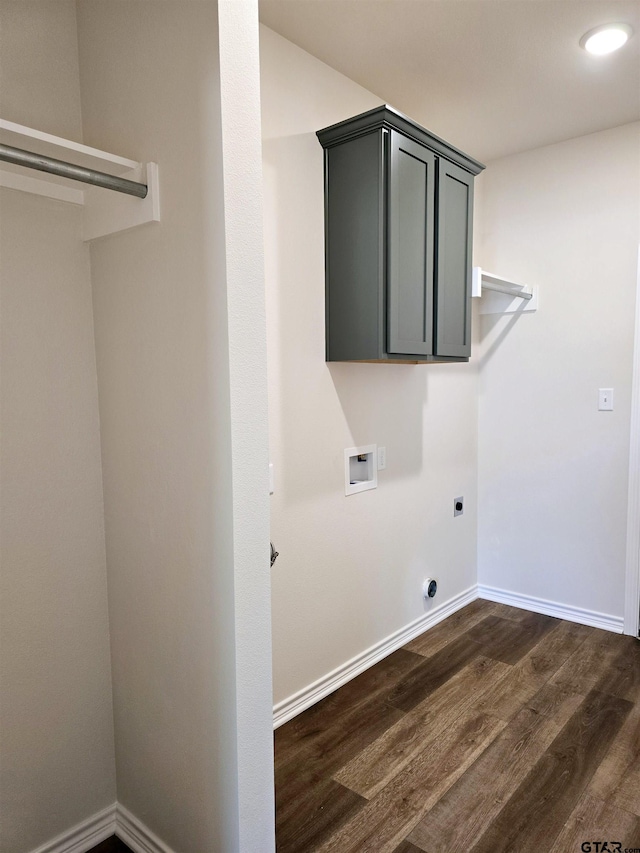 laundry room featuring electric dryer hookup, washer hookup, dark wood finished floors, and baseboards