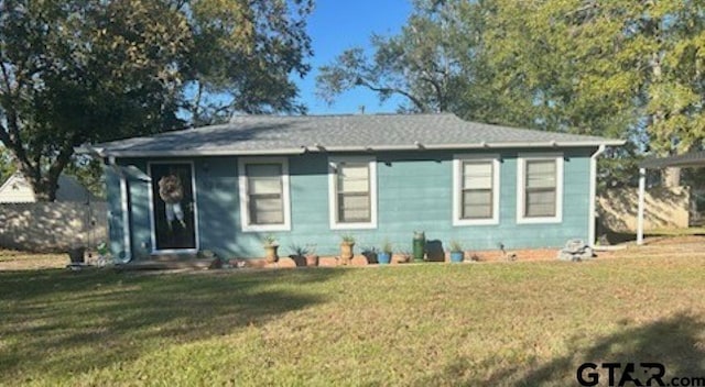 bungalow-style house with a front yard