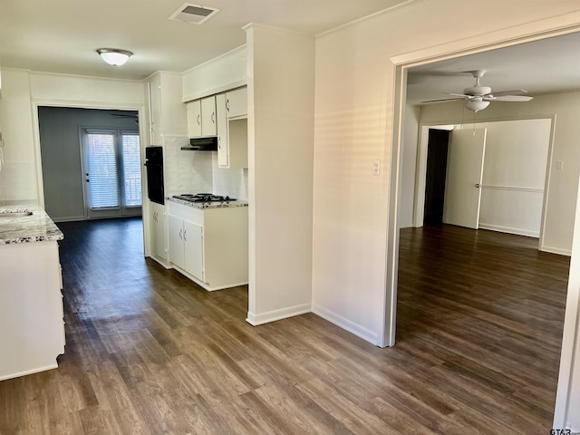 kitchen featuring ceiling fan, black oven, white cabinetry, and dark hardwood / wood-style floors