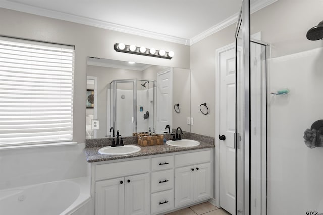 bathroom with vanity, plus walk in shower, tile patterned floors, and crown molding