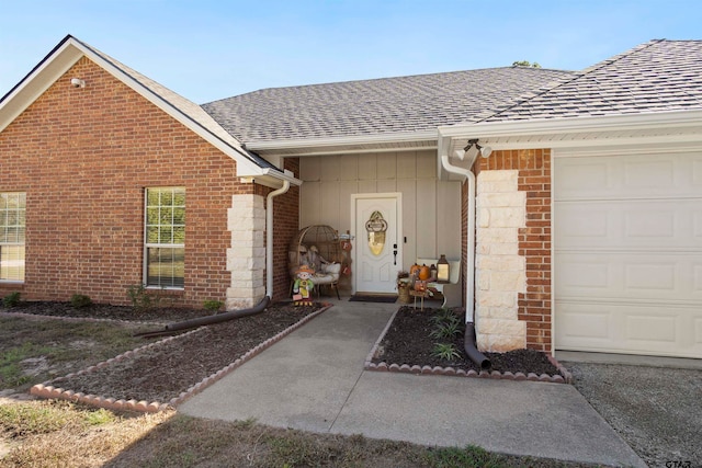 view of exterior entry featuring a garage