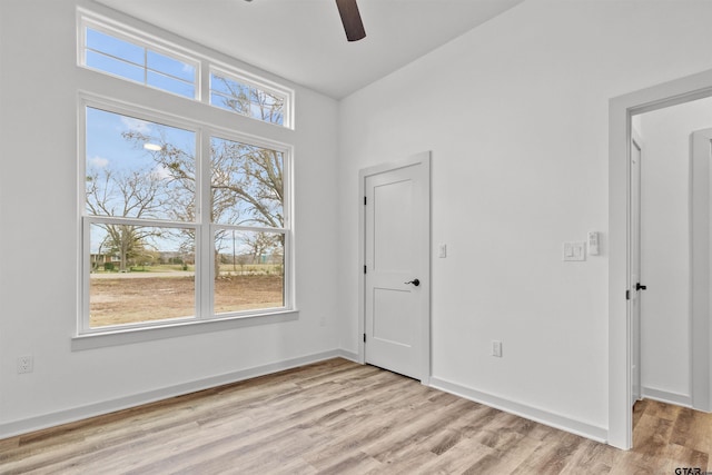 unfurnished room featuring ceiling fan and light hardwood / wood-style floors