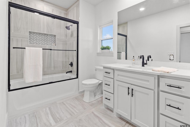 full bathroom featuring tile patterned flooring, vanity, toilet, and enclosed tub / shower combo