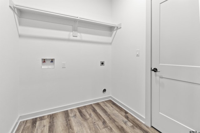 clothes washing area featuring hookup for a washing machine, wood-type flooring, and hookup for an electric dryer