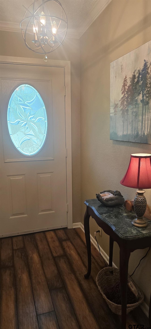 406 Brookwood Dr, Mount Pleasant, TX 75455 - foyer entrance with wood finished floors, a chandelier, and crown molding