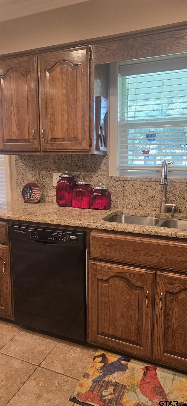 406 Brookwood Dr, Mount Pleasant, TX 75455 - kitchen featuring dishwasher, light tile patterned floors, healthy amount of natural light, and backsplash