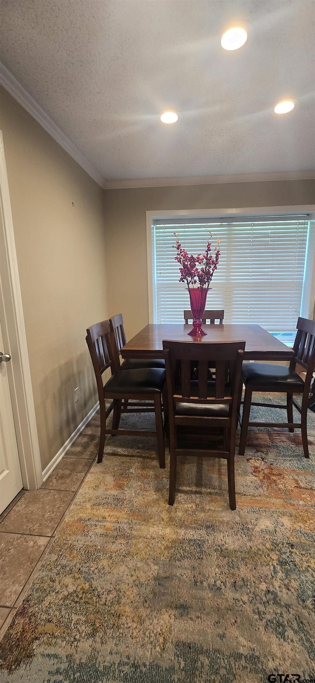 406 Brookwood Dr, Mount Pleasant, TX 75455 - tiled dining room with crown molding and recessed lighting