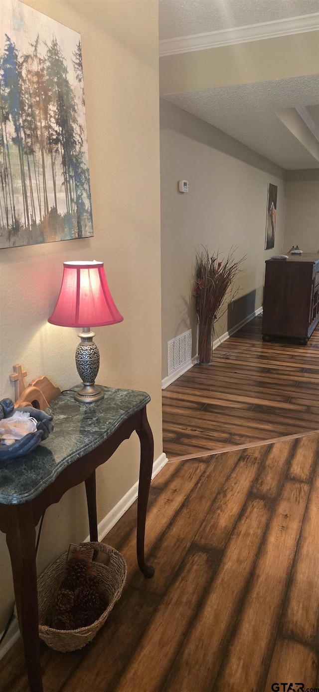 406 Brookwood Dr, Mount Pleasant, TX 75455 - hallway with wood finished floors and crown molding