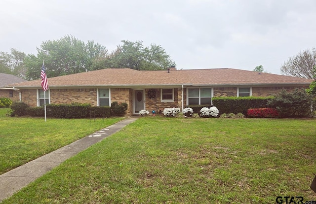 406 Brookwood Dr, Mount Pleasant, TX 75455 - ranch-style house with a front lawn and brick siding