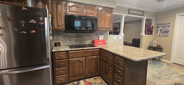 406 Brookwood Dr, Mount Pleasant, TX 75455 - kitchen featuring black appliances, ornate columns, a peninsula, backsplash, and crown molding