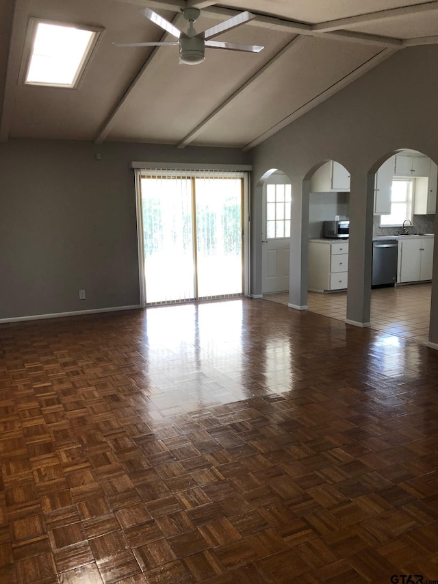 1516 Bowie Dr, Tyler, TX 75701 - spare room featuring vaulted ceiling, ceiling fan, and arched walkways