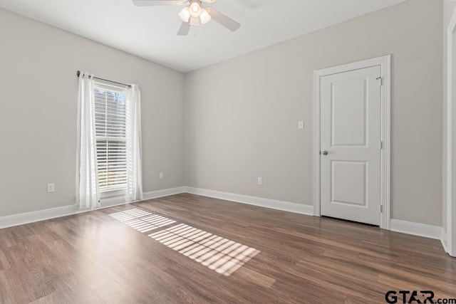 unfurnished room featuring hardwood / wood-style flooring and ceiling fan