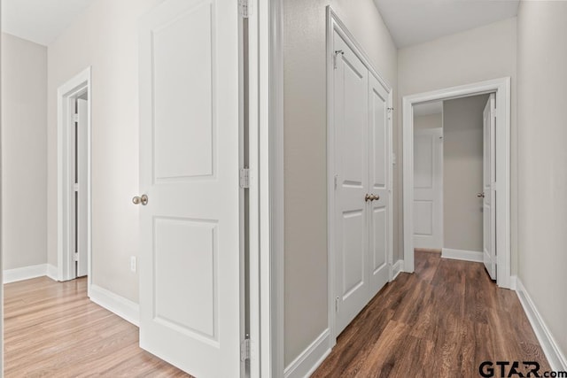 corridor featuring hardwood / wood-style floors