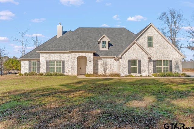 view of front of property with a front lawn