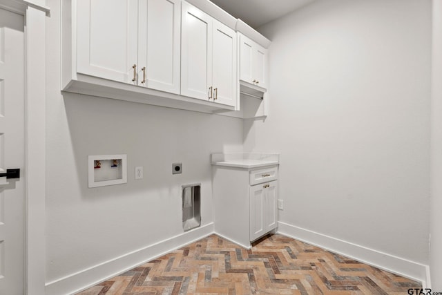 laundry room featuring cabinets, hookup for a washing machine, and electric dryer hookup