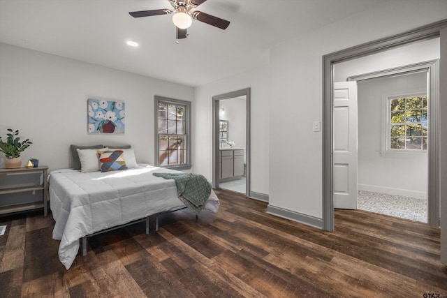 bedroom featuring dark wood-style flooring, baseboards, connected bathroom, a ceiling fan, and recessed lighting