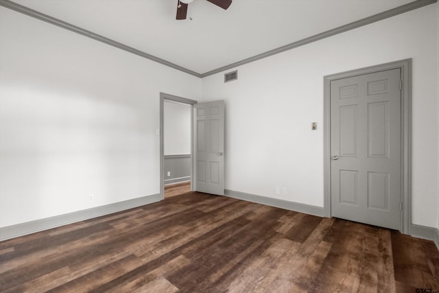 unfurnished bedroom featuring ornamental molding, wood finished floors, baseboards, and a ceiling fan