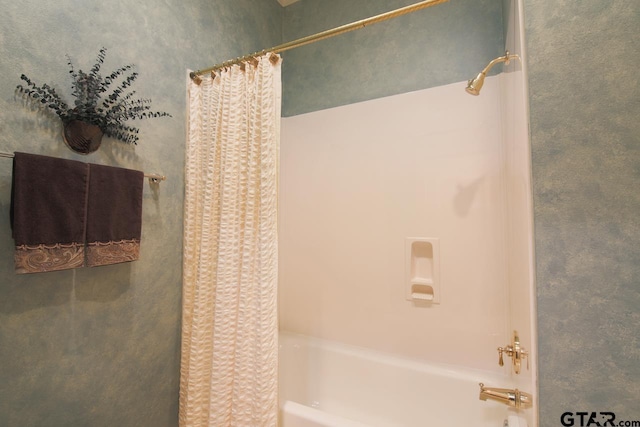 full bath featuring shower / tub combo with curtain