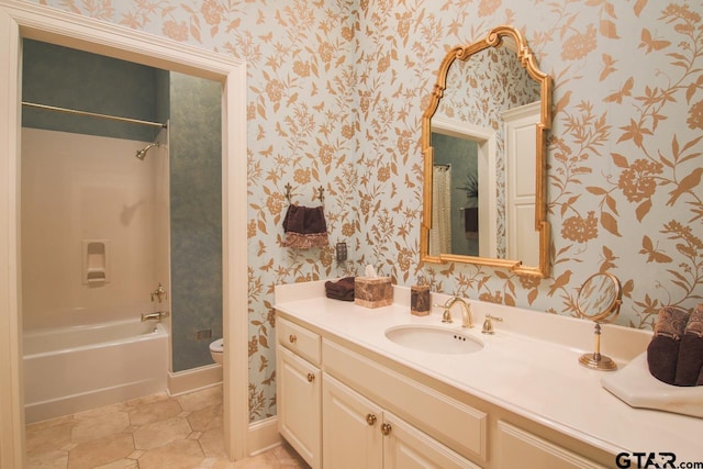 full bathroom featuring vanity, shower / bathtub combination, and toilet