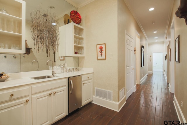 kitchen featuring visible vents, a sink, wood tiled floor, open shelves, and stainless steel dishwasher