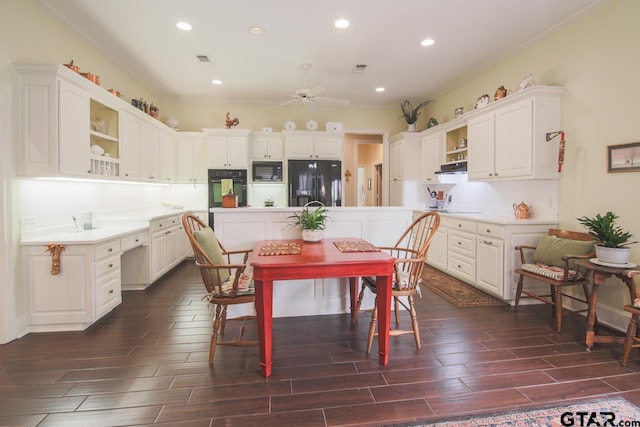 kitchen with open shelves, wood tiled floor, white cabinetry, under cabinet range hood, and black appliances