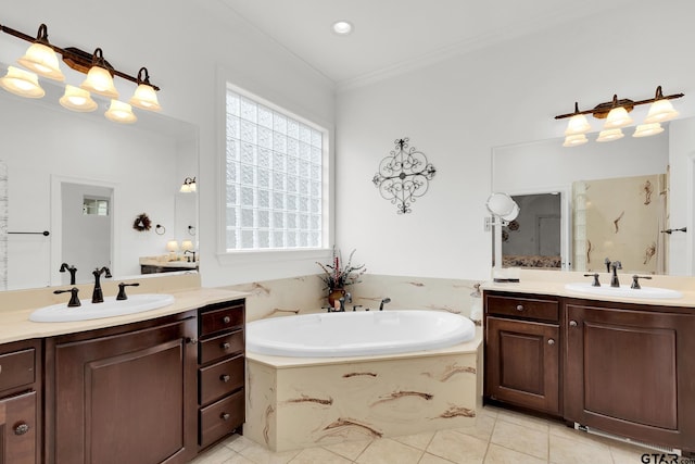 bathroom with vanity, a bath, tile patterned flooring, and crown molding