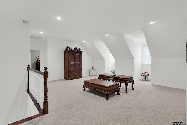 interior space with light colored carpet, lofted ceiling, and ornamental molding