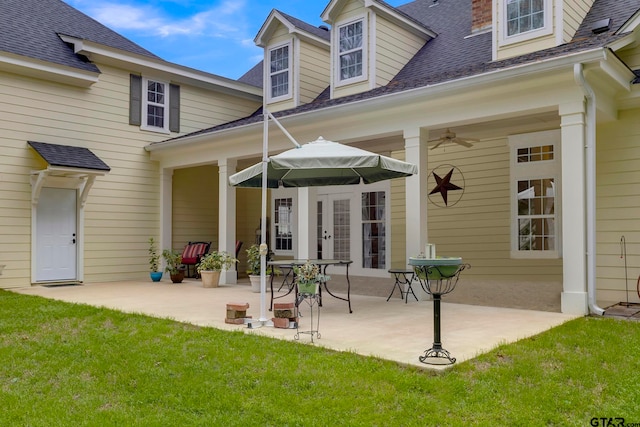 back of house featuring a patio, a lawn, and ceiling fan