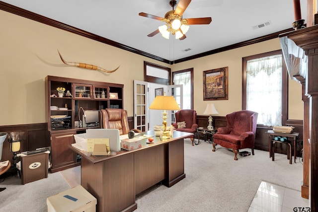 home office with ceiling fan, light colored carpet, and ornamental molding