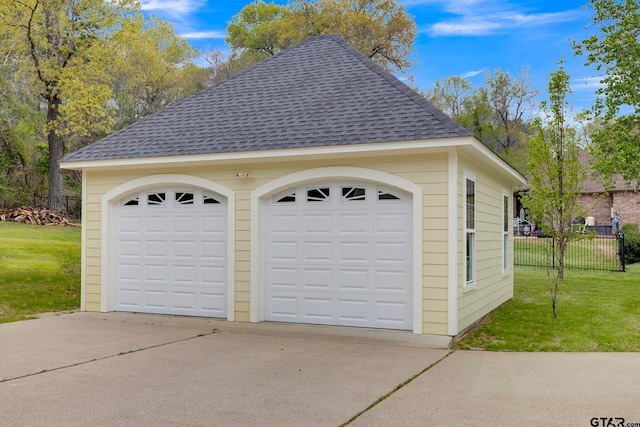 garage with a lawn